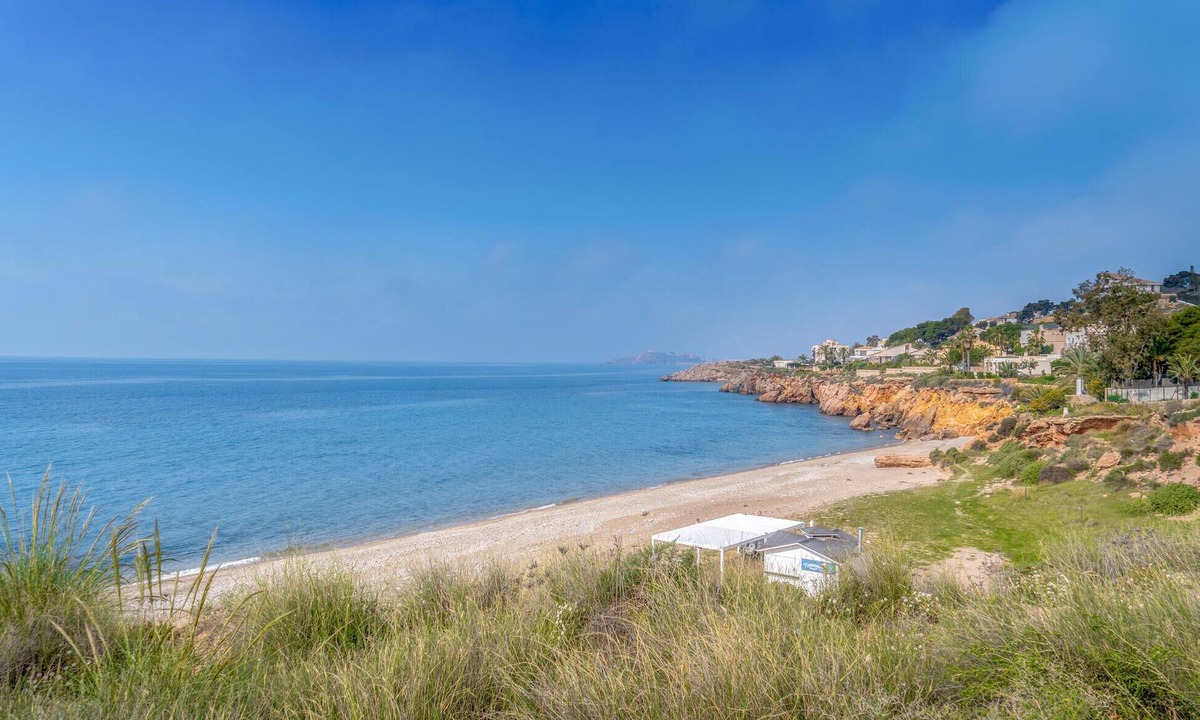 Isla Plana Apartment | Enjoy a relaxing vacation by the sea in this vacation apartment with a beautiful conservatory.