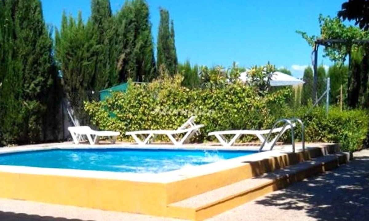 Chimeneas Villa | Homerez - Villa for 13 ppl. with swimming-pool, garden and terrace at Chimeneas