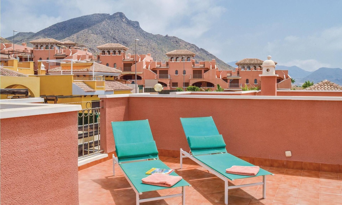 Isla Plana House | This cozy vacation terraced house with terrace is located only 650 meters from the pebble beach and