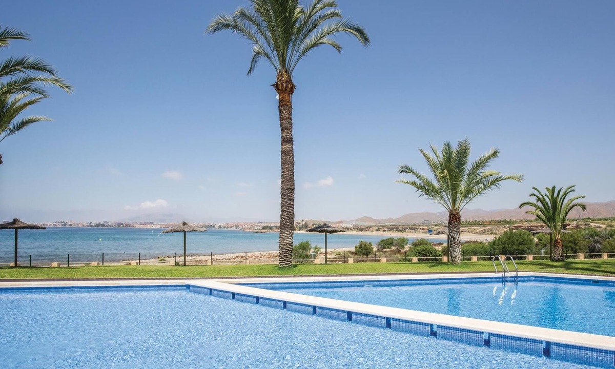 Isla Plana Apartment | This vacation apartment with modern equipment offers a magnificent view of the sea and the huge pool