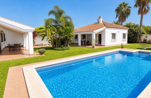 Campano Ski Chalet | Andalusian style houses (12p) with large swimming pool in subtropical garden