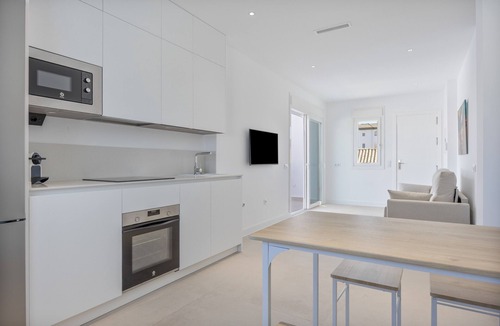 Poblado Sancti Petri Apartment | Apartment 'Los Drogos, Building A, Penthouse A' with shared pool, garden and Wi-Fi