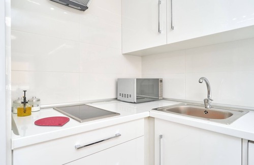 Caleta de Velez Apartment | Beachside Bliss Apartment with Shared Pool, Wi-Fi, and Air Conditioning