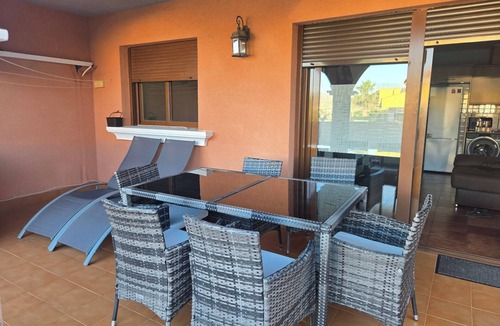 Isla Plana Apartment | Beautiful apartment 500 m from the beach with private garden and sea views