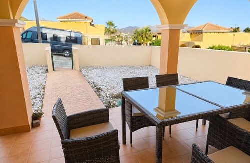 Isla Plana Apartment | Beautiful apartment 500 m from the beach with private garden and sea views