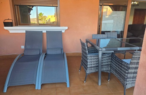 Isla Plana Apartment | Beautiful apartment 500 m from the beach with private garden and sea views