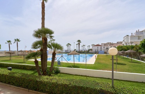 Mezquitilla Apartment | Holiday Home 'Algarrobo Costa Studio Sun-sat' with Shared Pool, Shared Garden and Air Conditioning