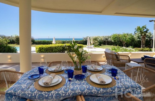 Nikki Beach Apartment | Holidays & Home Beachfront Neptuno III , sea views,and garden,Elviria