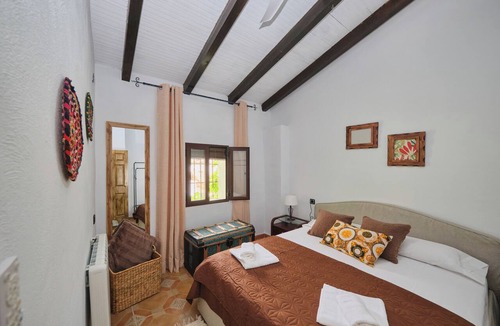 Arenas del Rey Bed & Breakfast | Luxury bedroom at Los Retamales with a queen-size bed, Casa Mathilda