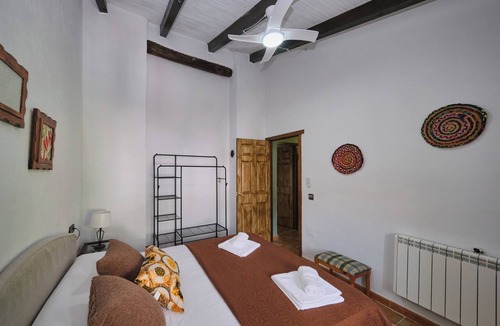 Arenas del Rey Bed & Breakfast | Luxury bedroom at Los Retamales with a queen-size bed, Casa Mathilda