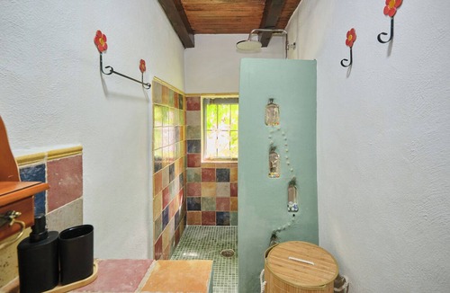 Arenas del Rey Bed & Breakfast | Luxury bedroom in Tejeda with a view of Lake Bermejales.