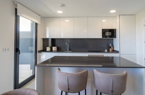 Rincon de la Victoria Apartment | Modern Costa Living: Sleek Three-Bedroom Apartment with Shared Pool & Fitness Center