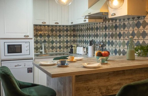 Miraflores de la Sierra Apartment | Recharge your batteries!Charming and cozy town house 7 minutes walk from the center and five from the river. Completely renovated in a retro style, preserving the natural stone and decoration brought from all over the world.Perfect to rest with great det