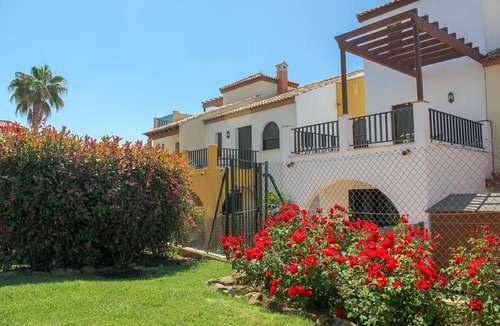 Costa Esuri Ski Chalet | ROU002 Townhouse with Private Garden and Direct Access to the Pool