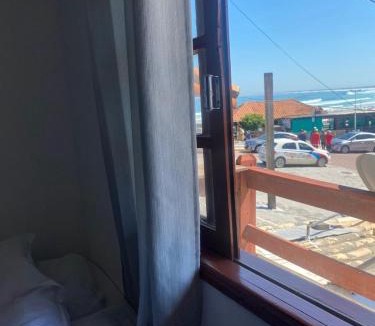Praia Grande Hotel | Suites e Quartos Em frente a Praia Grande -Na orla Flavia Alessandra