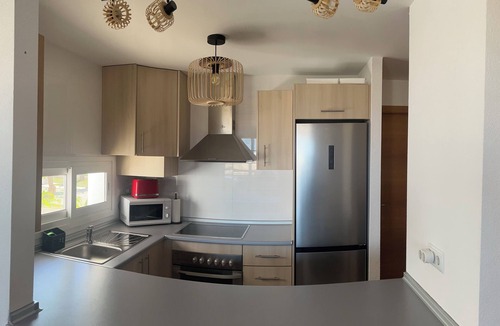 Roldan Apartment | Very well-equipped family apartment in a quiet golf course with swimming pool.