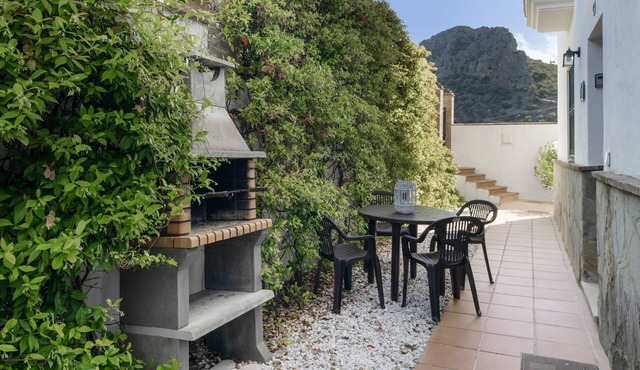 Apartment 'Casa Riguelas' with Mountain View, Shared Pool and Shared Garden