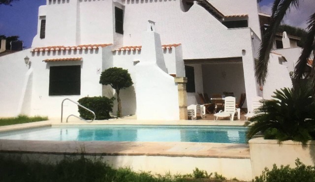 House with pool near the beach and marina in Cala en Bosc