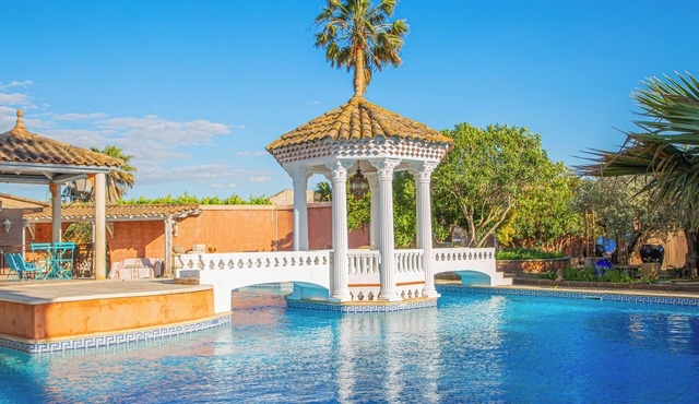 Luxury studio-style room across from the pool with a private terrace in Fourques