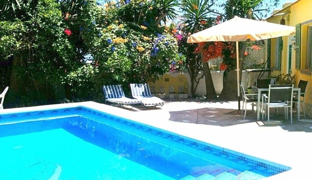 Relax by your private pool surrounded by garden or at beach only 300 meters .