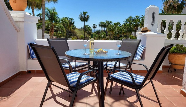Relax.south facing terrace, all day sun, views of tropical gardens and pools