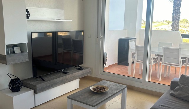 Very well-equipped family apartment in a quiet golf course with swimming pool.