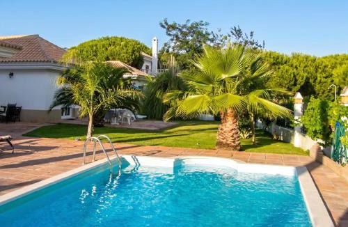 Nuevo Portil Villa | Elegant Villa in Nuevo Portil with Shared Pool